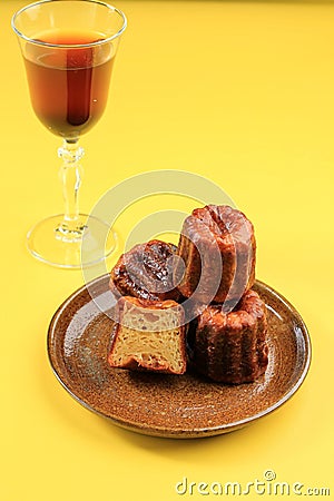 Caneles de Bordeaux - Traditional French Sweet Dessert On Ceramic Plate Stock Photo