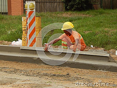 Construction worker building a street.. Editorial Stock Photo