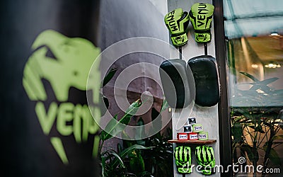 Canggu, Bali, Indonesia, 16 July 2021. Punching bag and boxing gloves on the brick wall background Editorial Stock Photo