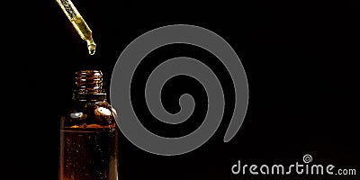 Cannabidiol oil in a small amber bottle Stock Photo