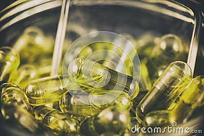 Cannabis extraction capsules infused with CBD oil in a jar Editorial Stock Photo