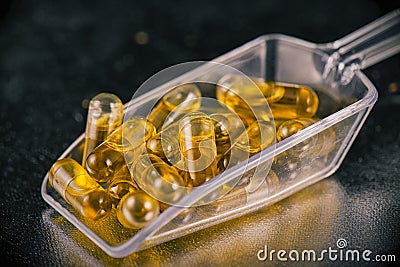 Cannabis extraction capsules infused with shatter Stock Photo