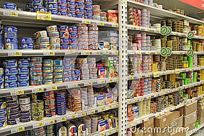 Canned fish on shelves of supermarket store Editorial Stock Photo
