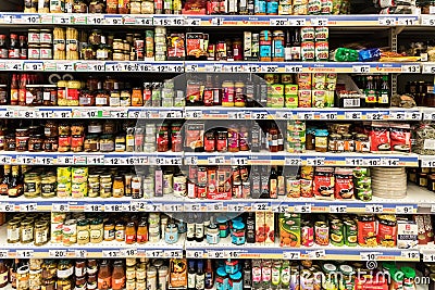 Canned Food And Special Sauces On Supermarket Stand Editorial Stock Photo