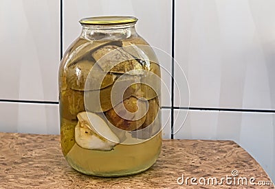 Canned pear in glass jar. Stock Photo