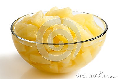 Canned pineapple pieces in a glass bowl. Stock Photo