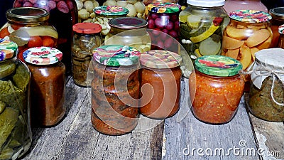 The canned products - vegetables and fruits in glass jars Stock Photo