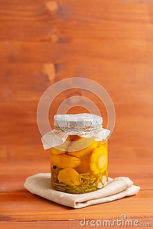 Canned squash glass jar. With dill, carrots, sweet peppers. Beautifully and figuratively carved Stock Photo