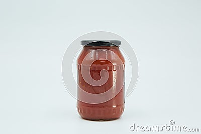 Canned tomato paste in a glass jar. Home canning. Long-term food Stock Photo