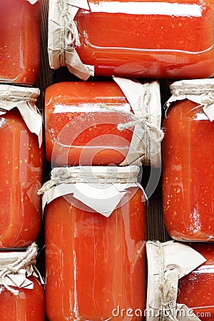 Canned tomato paste in plastic free sustainable jars, conserves for winter eat, flat lay, from above overhead top view Stock Photo