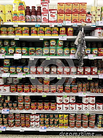 Canned Tomatoes at a Grocery Store Editorial Stock Photo