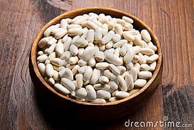 Cannellini beans on wood bowl Stock Photo