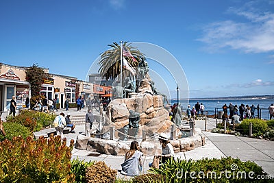 Cannery Row Monument on coastline with sea and blue sky in the background Editorial Stock Photo