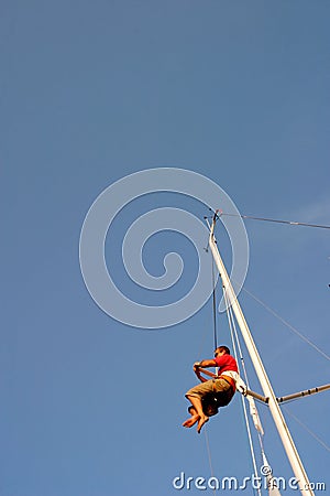 Sailor climbing mast Editorial Stock Photo