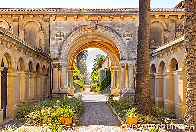 Cloisters of Abbaye de Lerins monastery with Saint Marie Holy Mary church on Saint Honorat island offshore Cannes in France Editorial Stock Photo