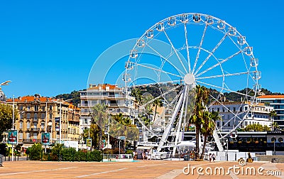 Grande Roue Ferris Wheel at Promenade de la Pantiero square aside yacht marina in Cannes in France Editorial Stock Photo