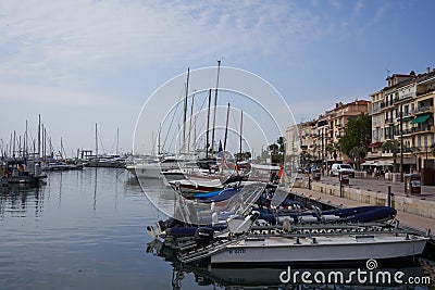 Cannes, France - June 16, 2021 - Quai Saint-Pierre street sunny morning in the Old Port of Cannes Editorial Stock Photo