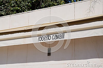 Roberto Cavalli logo sign and brand text on store facade Italian fashion designer and inventor Editorial Stock Photo