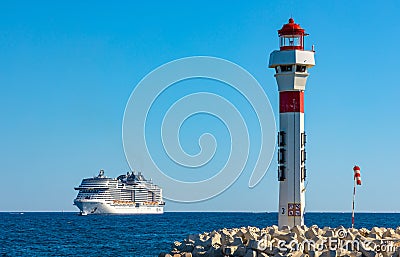Cannes seafront panorama with lighthouse and MSC Meraviglia cruiser ship offshore French Riviera on Mediterranean Sea in France Editorial Stock Photo