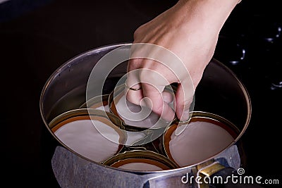 Canning lids in water Stock Photo