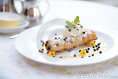 cannoli with chocolate chips on a white plate Stock Photo