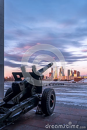 A cannon near the Victory Museum. Winners Square in Victory Park on Poklonnaya Hill in winter sunset. Editorial Stock Photo