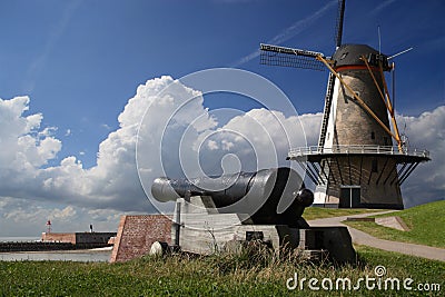 Windmill and cannon Stock Photo