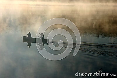 Canoe in the morning mist Stock Photo