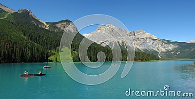 Landscape Panorama of Red Canoes on Glacial Emerald Lake, Yoho National Park, British Columbia Stock Photo