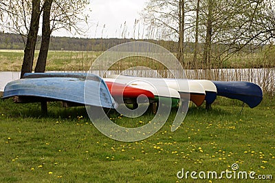 Canoes jacked riverside Stock Photo