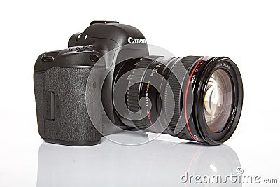 Canon EOS 5D Mark IV profesional DSLR photo camera on white reflective background Editorial Stock Photo
