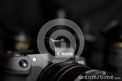 Canon EOS R photocamera with Canon lenses on black table. Canon EOS R is 30mp full-frame mirrorless interchangeable-lens camera Editorial Stock Photo