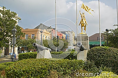 Canons and French Golden statue in French Quarter of New Orleans, Louisiana Editorial Stock Photo