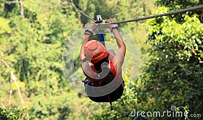 Canopy zip lining tirolesa in Costa Rica Tour Beautiful Girl Stock Photo