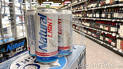 Cans of Natural Light Beer also called Natty Light in a Publix grocery store Editorial Stock Photo