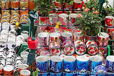 Cans with roses, souvenirs for sale at Dutch flower market, Amsterdam, Netherlands Stock Photo