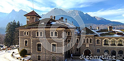 Cantacuzino Castle (Wednesday) with the Bucegi Mountains in the background in Busteni Editorial Stock Photo