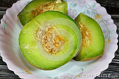The cantaloupe, rockmelon (Australia and New Zealand, although cantaloupe), sweet melon, or spanspek Stock Photo