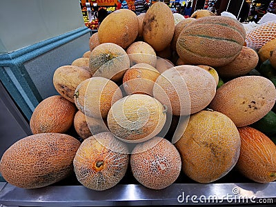 The cantaloupe, rockmelon, sweet melon, or spanspek is a melon that is a variety of the muskmelon species from the family Cucurbit Stock Photo