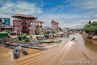 Inle Boat Station in Inle Nyaung Shwe Canal. A series of fishing boats along the river generated by Inle Lake Editorial Stock Photo