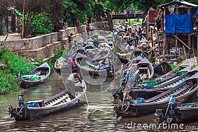 Inle Boat Station in Inle Nyaung Shwe Canal in Burma. A series of wooden fishing boats along the river generated by Inle Lake Editorial Stock Photo