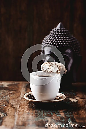 Cantuccini Italian cookie and a Cup of coffee on rustic wooden background Stock Photo