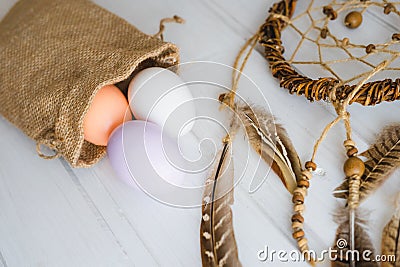 Happy Easter day. A canvas bag with Easter painted eggs. Stock Photo