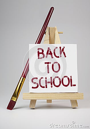 Canvas with brush and back to school Stock Photo