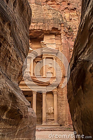 Canyon in the ancient city of Petra (Jordan) - opening view of the famous Al-Khazneh (aka Treasury) Stock Photo