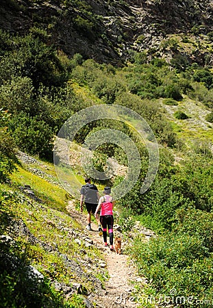 Couple hikers in the Guadiaro river near the Canyon of the Buitreras, Spain Editorial Stock Photo