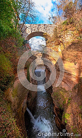 canyon with rock bridge colorful beautiful orange without people with clear blue sky vertical background Ravine Orrido Stock Photo