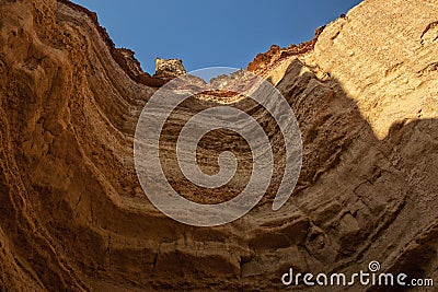 Canyon wall viewed from below in arc format with detail of water erosion marks. Namibe. Angola. Africa Stock Photo