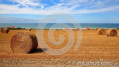 Cap Blanc Nez, Cote d`Opale, Pas-de-Calais, France: Fields with bales of Hay. View with the sea in the background Stock Photo