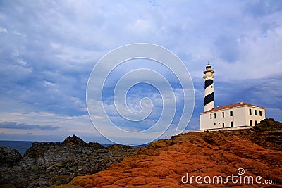 Cap de Favaritx sunset lighthouse cape in Mahon Stock Photo
